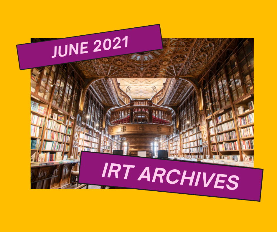 Interior of an old library with a large vaulted ceiling and floor to ceiling shelves of books.